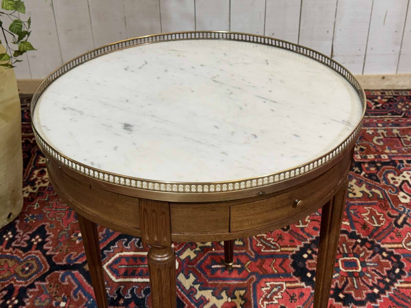 Louis XVI style bouillotte table from the 1960s in mahogany with a marble top.