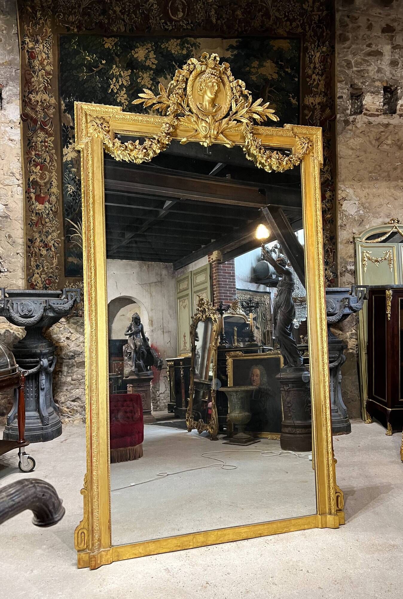 Monumental mirror Napoleon III in gilded wood with the profile of Apollo