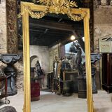 Monumental mirror Napoleon III in gilded wood with the profile of Apollo
