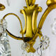 Bronze wall light with rococo style Louis XV pendants.