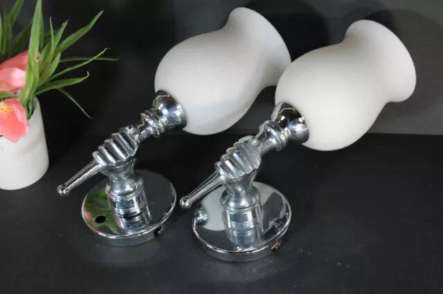 Pair of chrome-plated metal wall lights, hand-shaped with lampshade