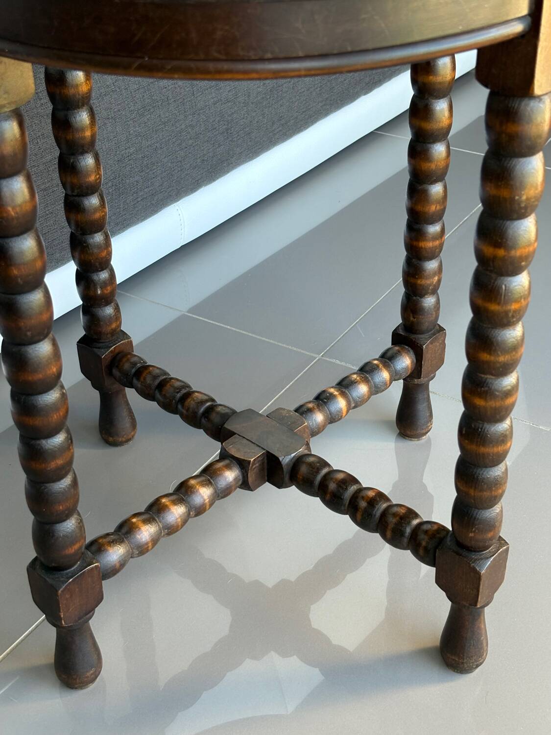 Antique turned wooden side table with authentic charm.