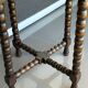 Antique turned wooden side table with authentic charm.