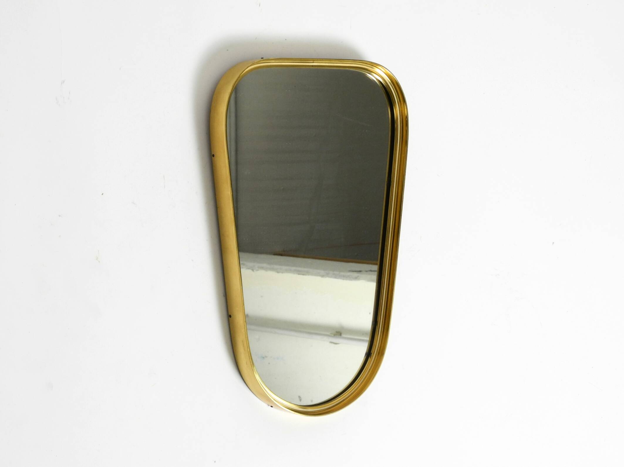 Small solid Mid Century brass wall mirror by Münchener Zierspiegel
