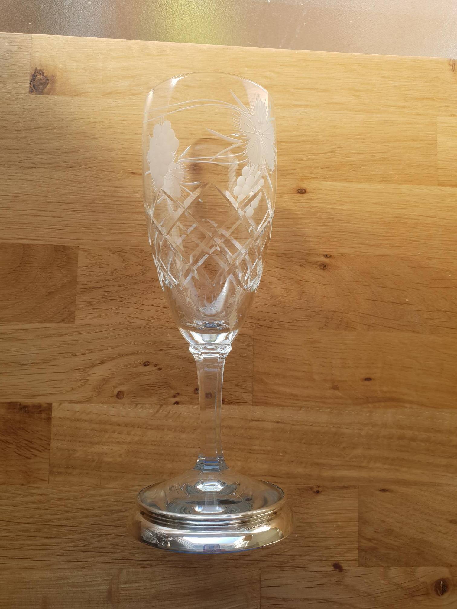 Crystal flutes with a silver rimmed foot