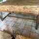 Renovated raw wood farmhouse table