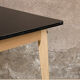 Vintage table in solid beech and black laminate tray