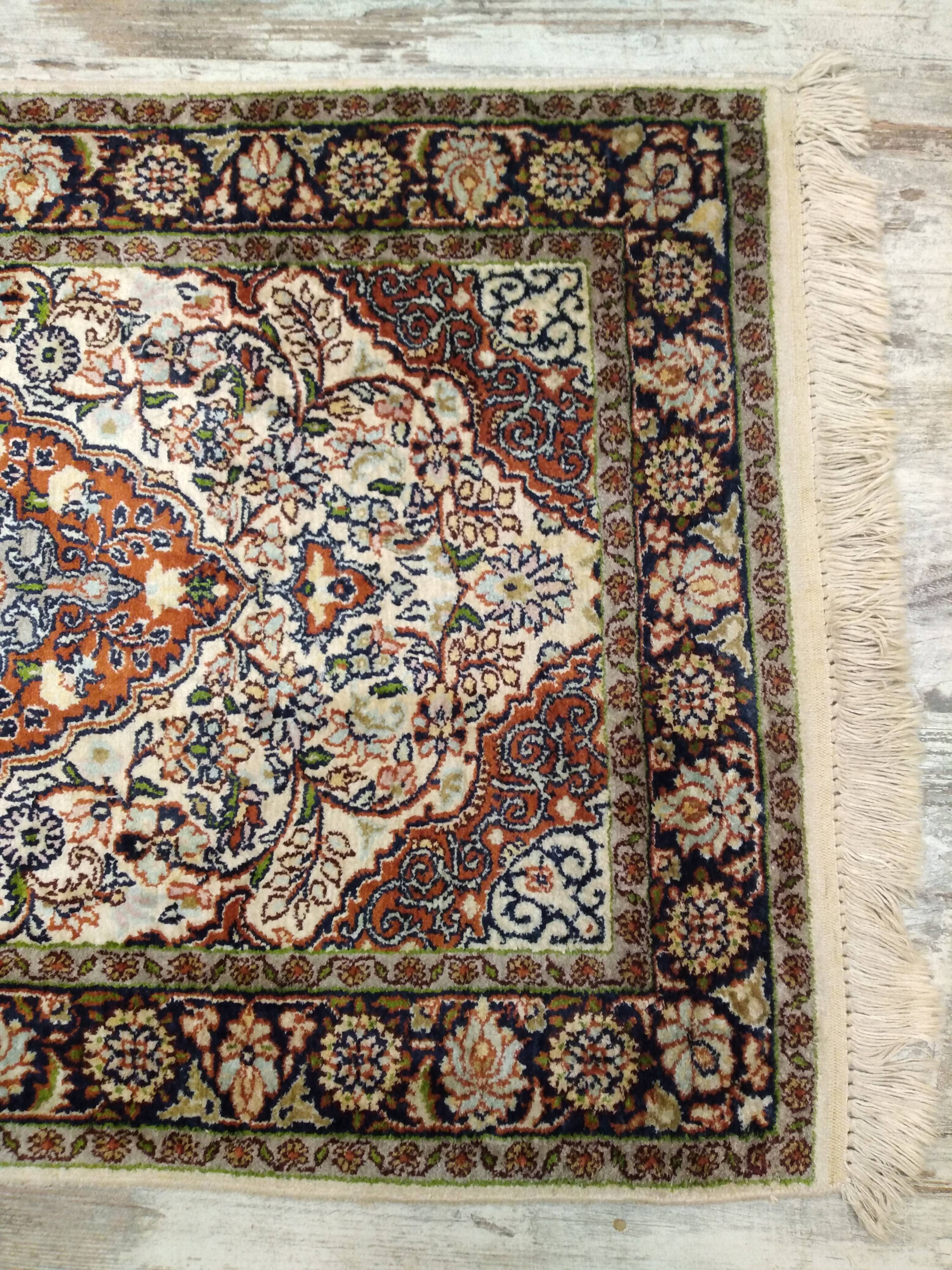 Handmade Persian wool and silk rug