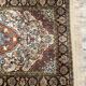 Handmade Persian wool and silk rug