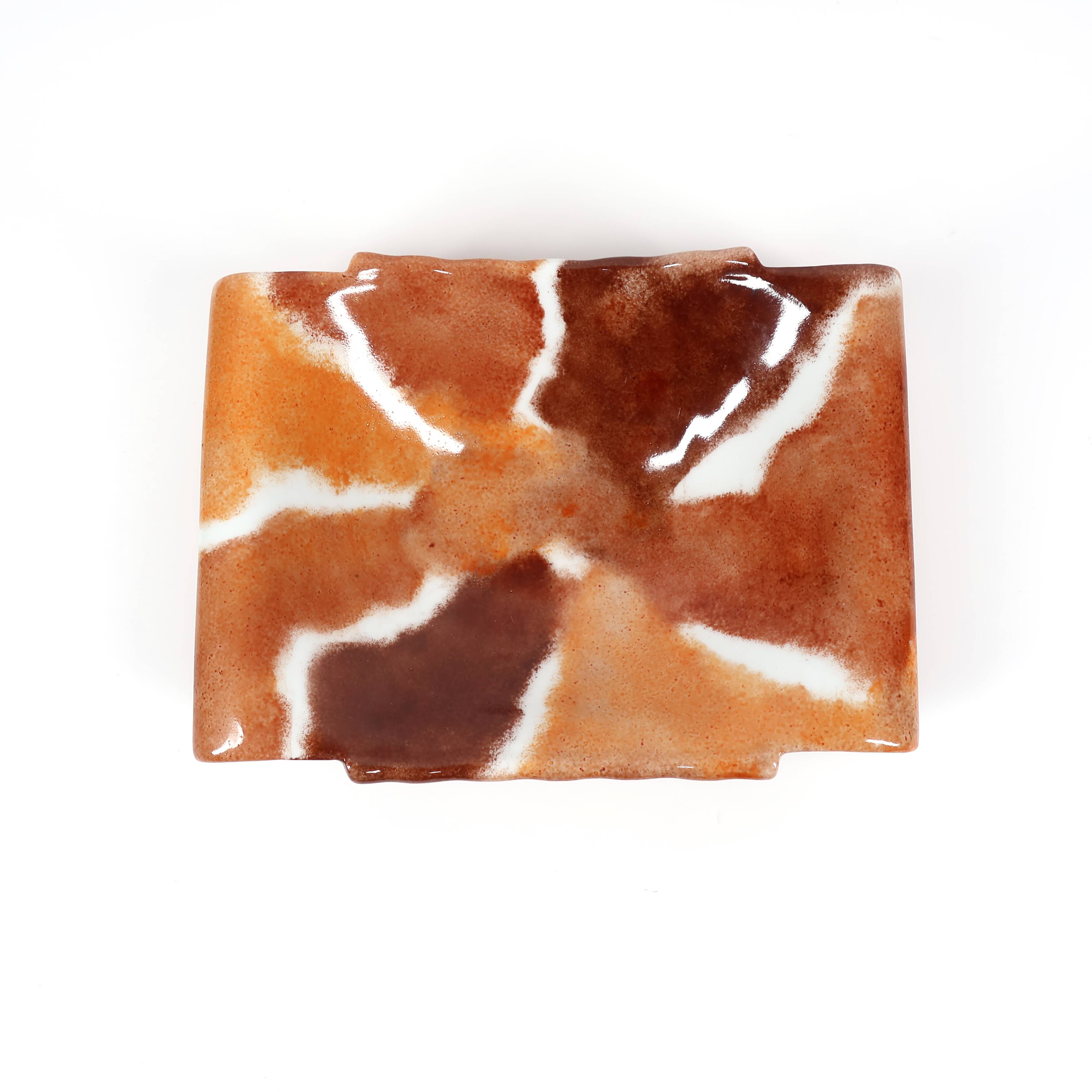 Handcrafted ceramic trinket dish in shades of brown and orange