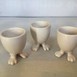 Set of cracked egg cups with feet
