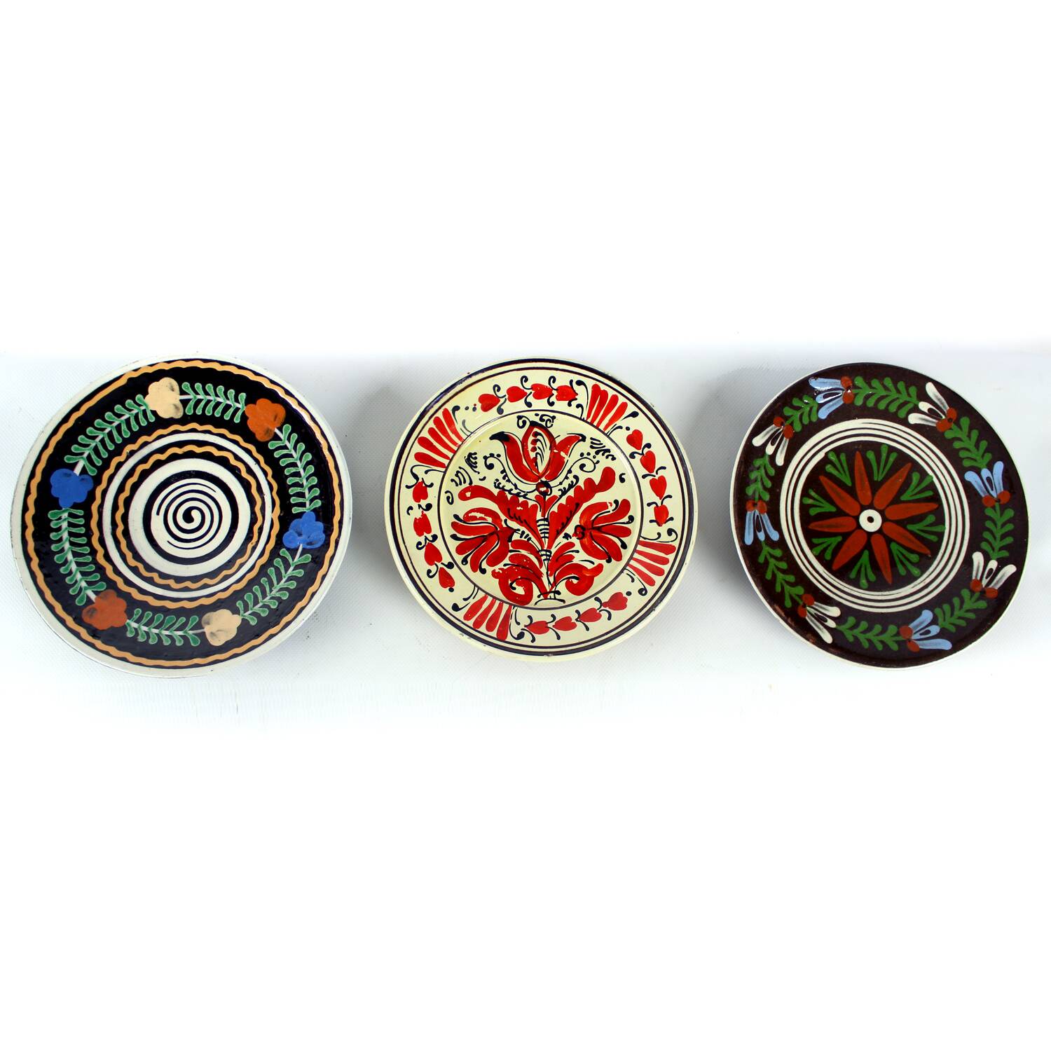 Set of three vintage folk art ceramic wall plates, Czechoslovakia and Romania.
