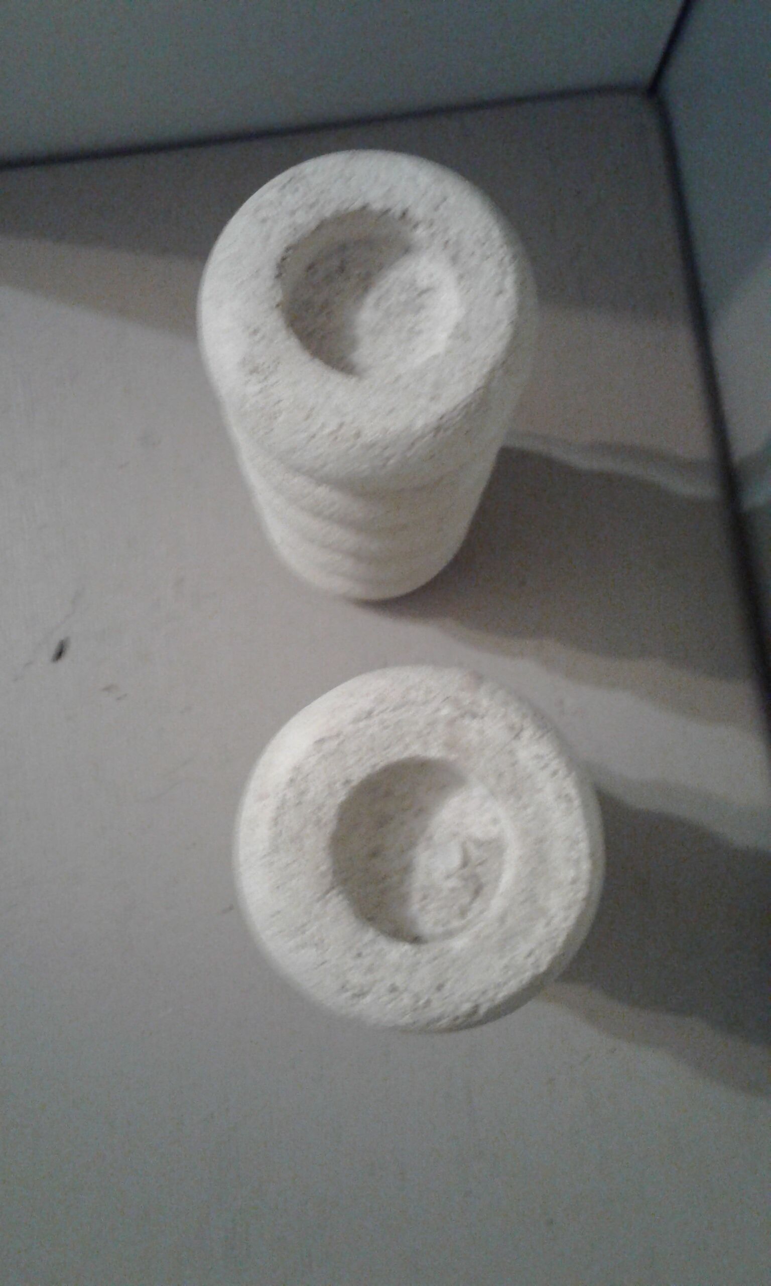 Pair of stone candlesticks