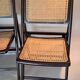 Pair of caned folding chairs from the 1960s in varnished wood.
