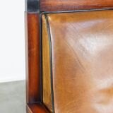 Sheep leather and wood armchair with an Art Deco design