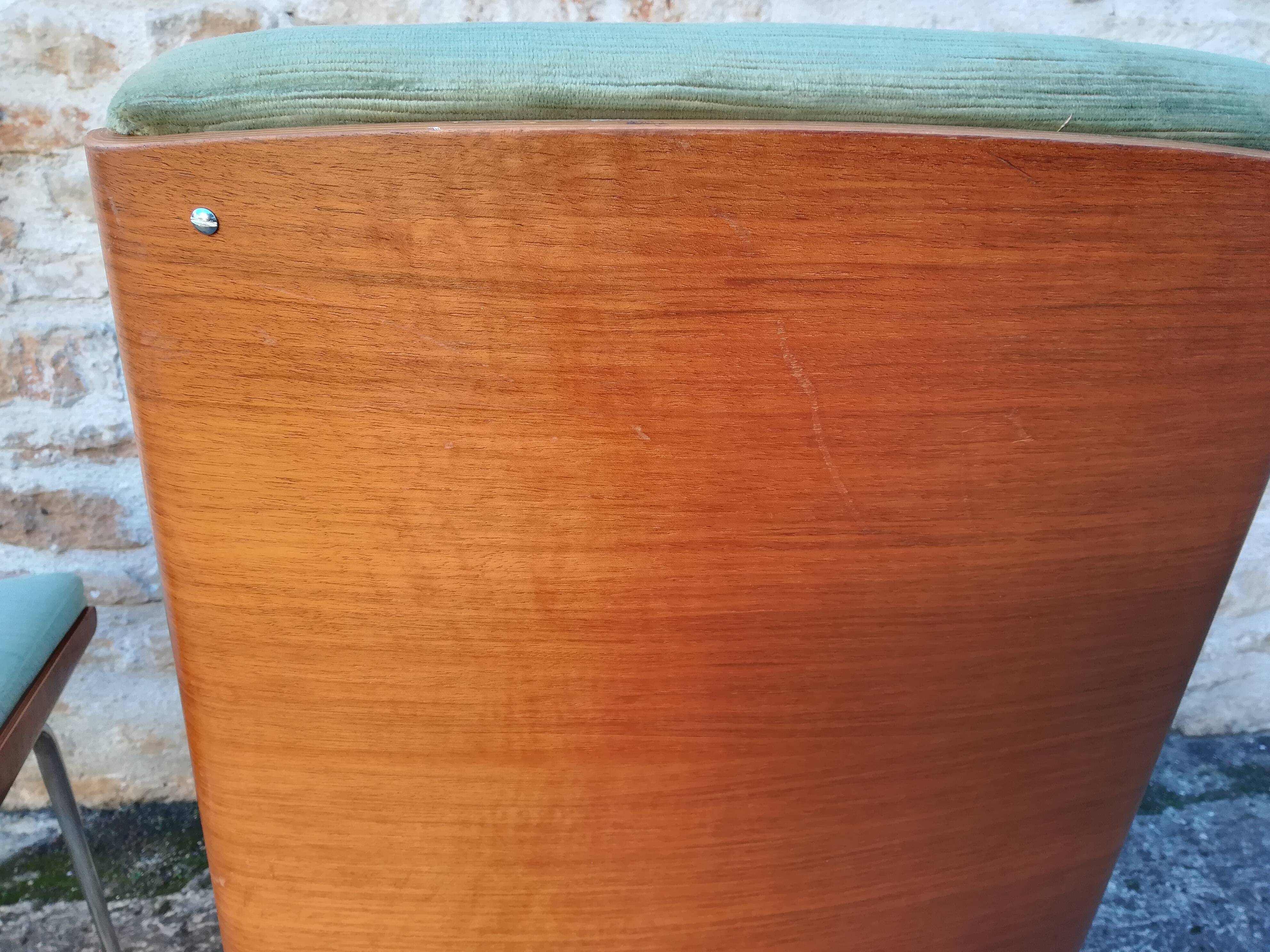 Shell chairs and green fabric