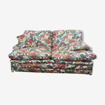 Old flowery sofa in feather