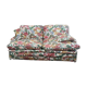 Old flowery sofa in feather