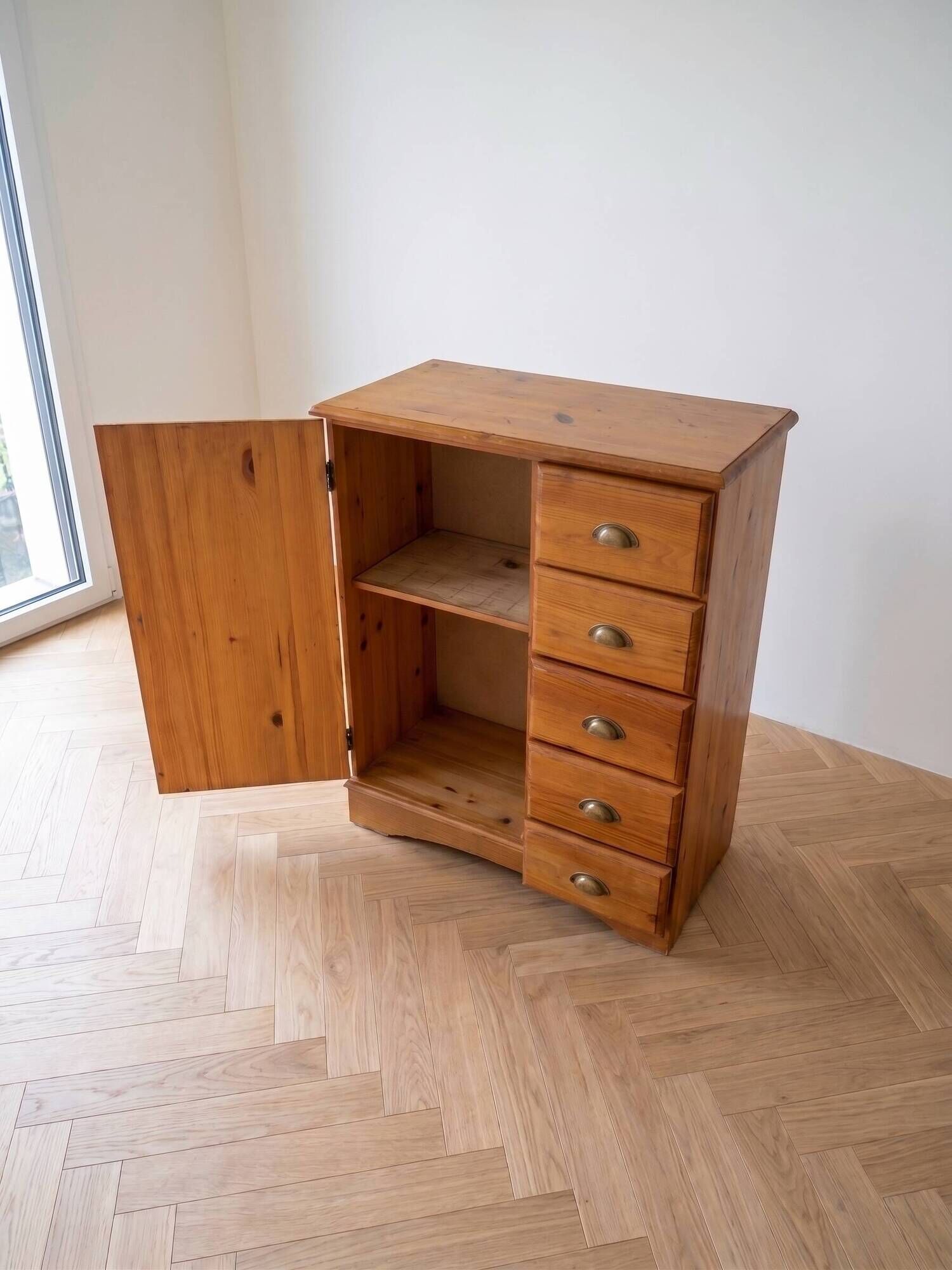 Vintage wooden storage cabinet with drawers