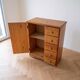 Vintage wooden storage cabinet with drawers