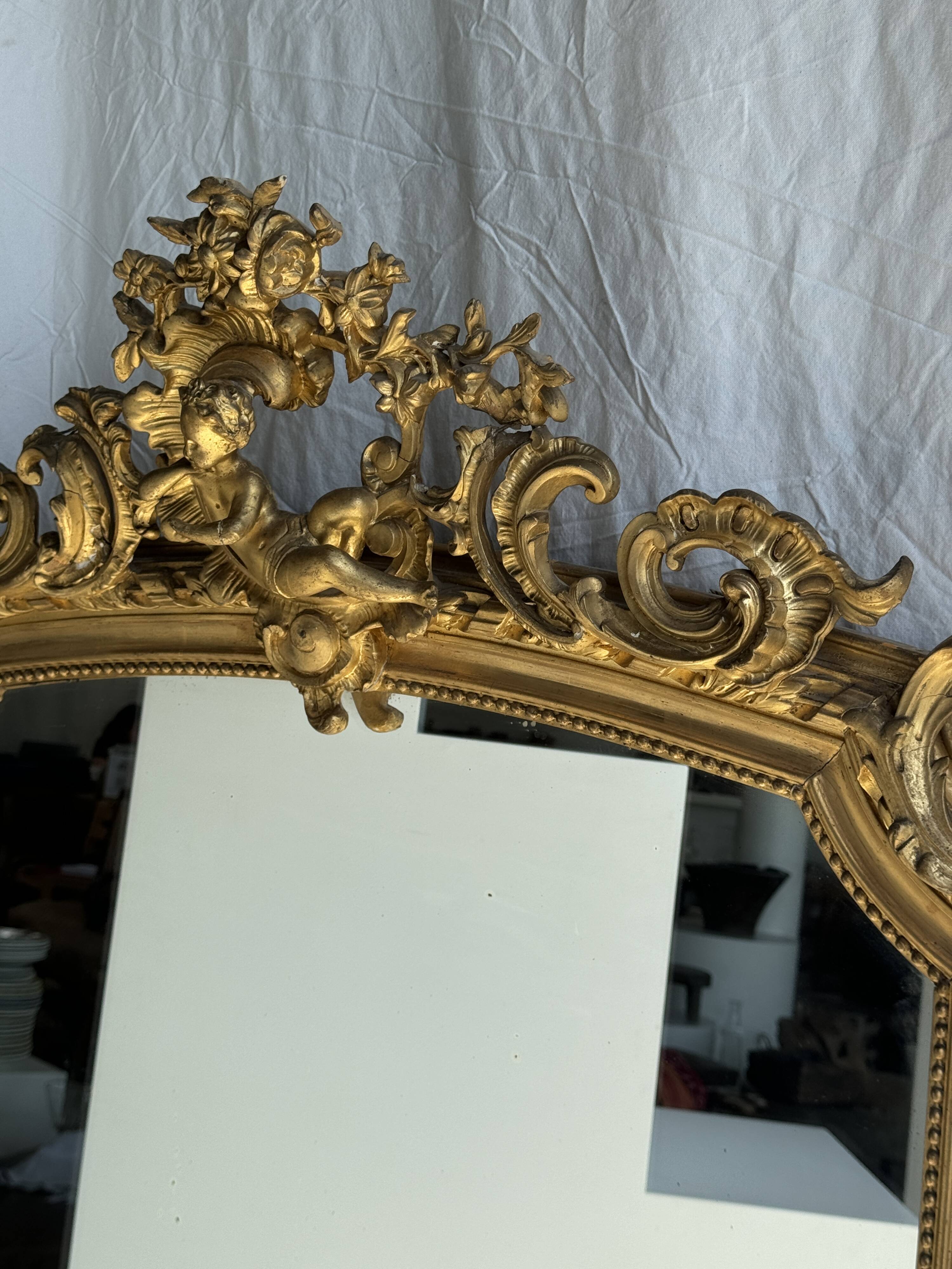 Large gilded mirror with acanthus leaf pediment H150 L98