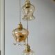 Triple vintage tulip pendant light in amber glass