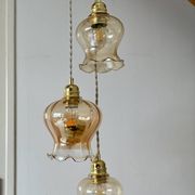 Triple vintage tulip pendant light in amber glass