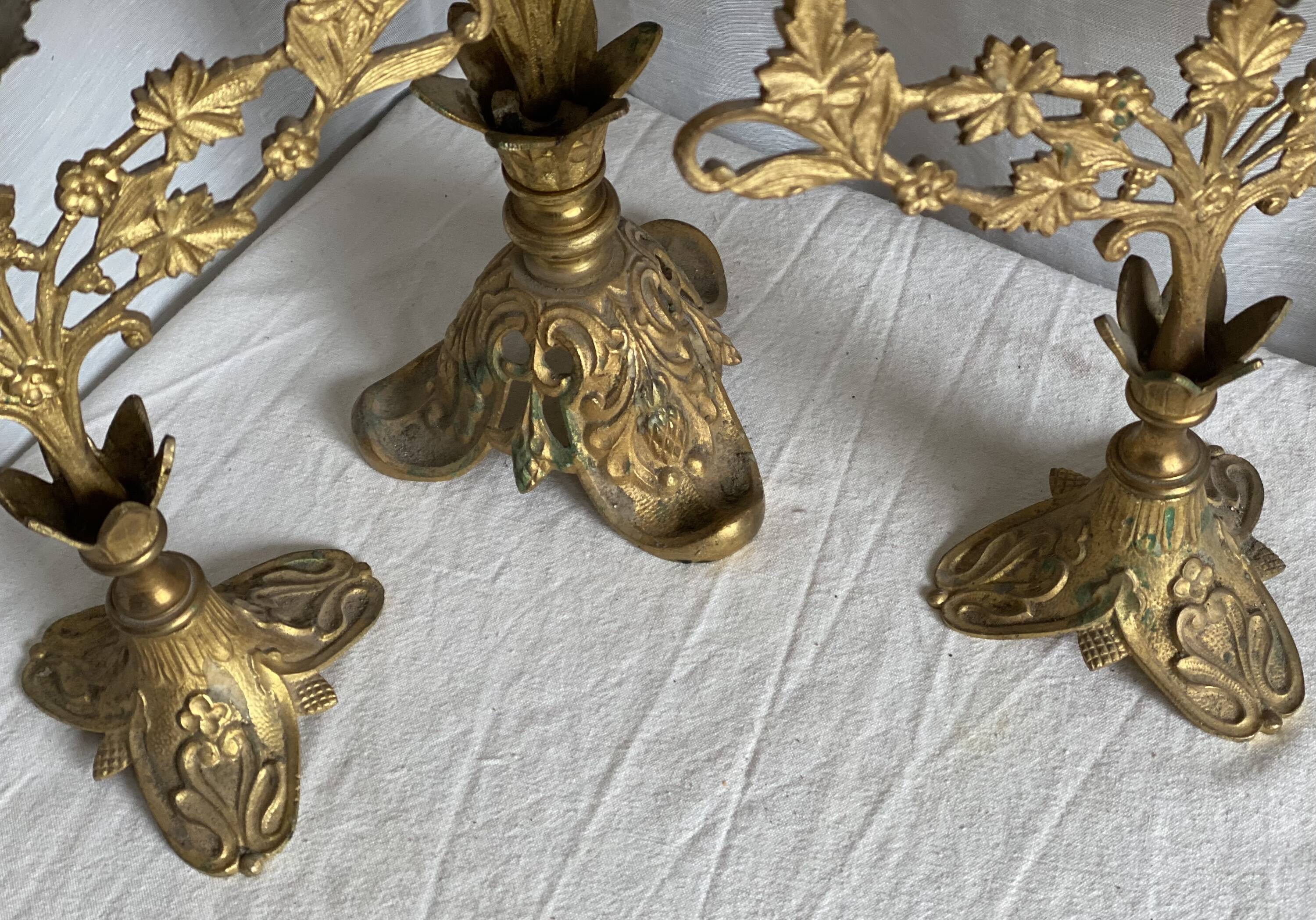 Set of 3 gilt metal candlesticks from the early 20th century.