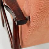 Mid-century modern armchair in coral red designed by H. Lis.