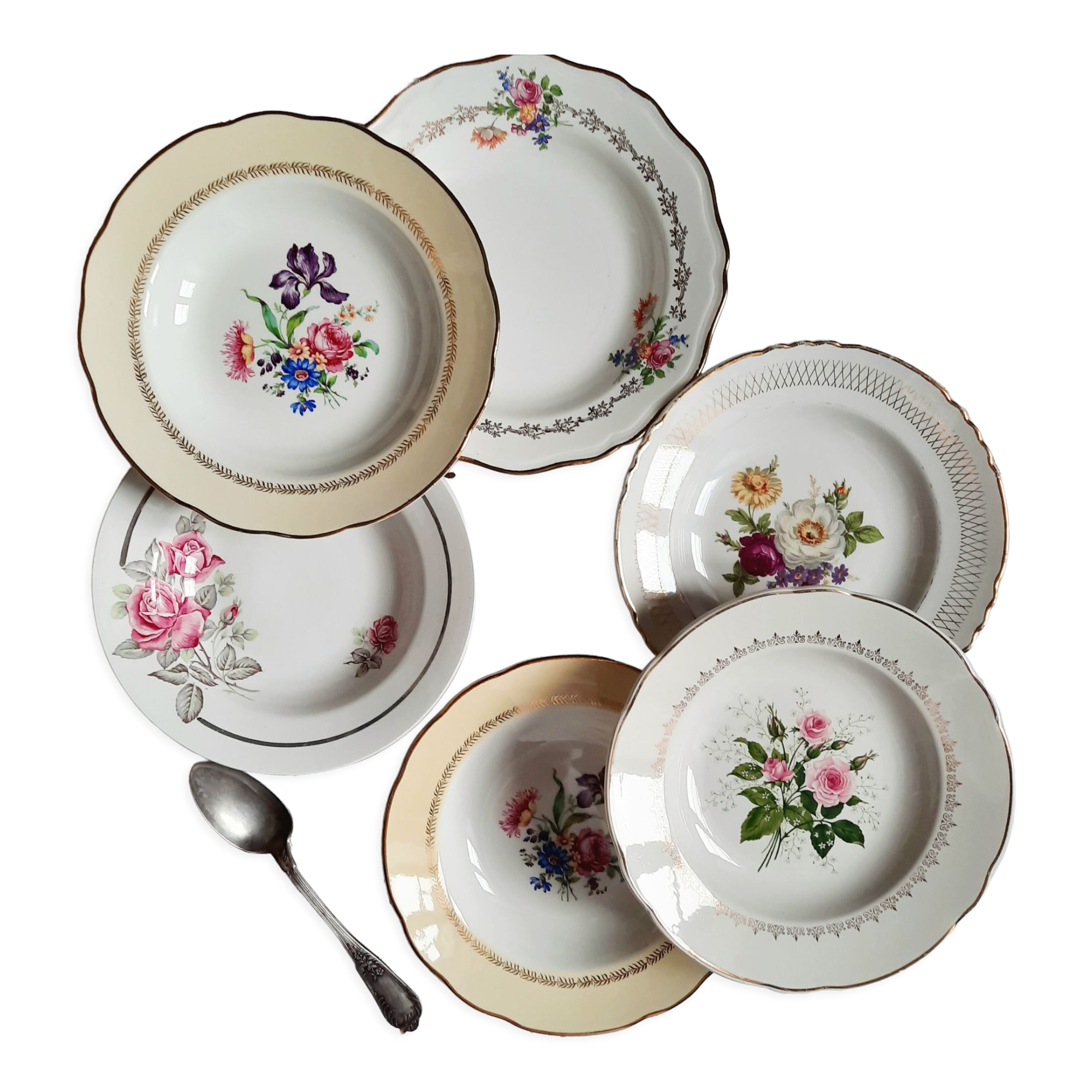 Old hollow plates mismatched in earthenware with gilded edges