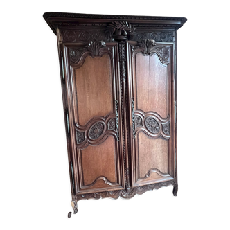 Old norman wardrobe in solid oak and carved nineteenth century