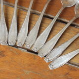 15 small silver metal spoons with rows of beads