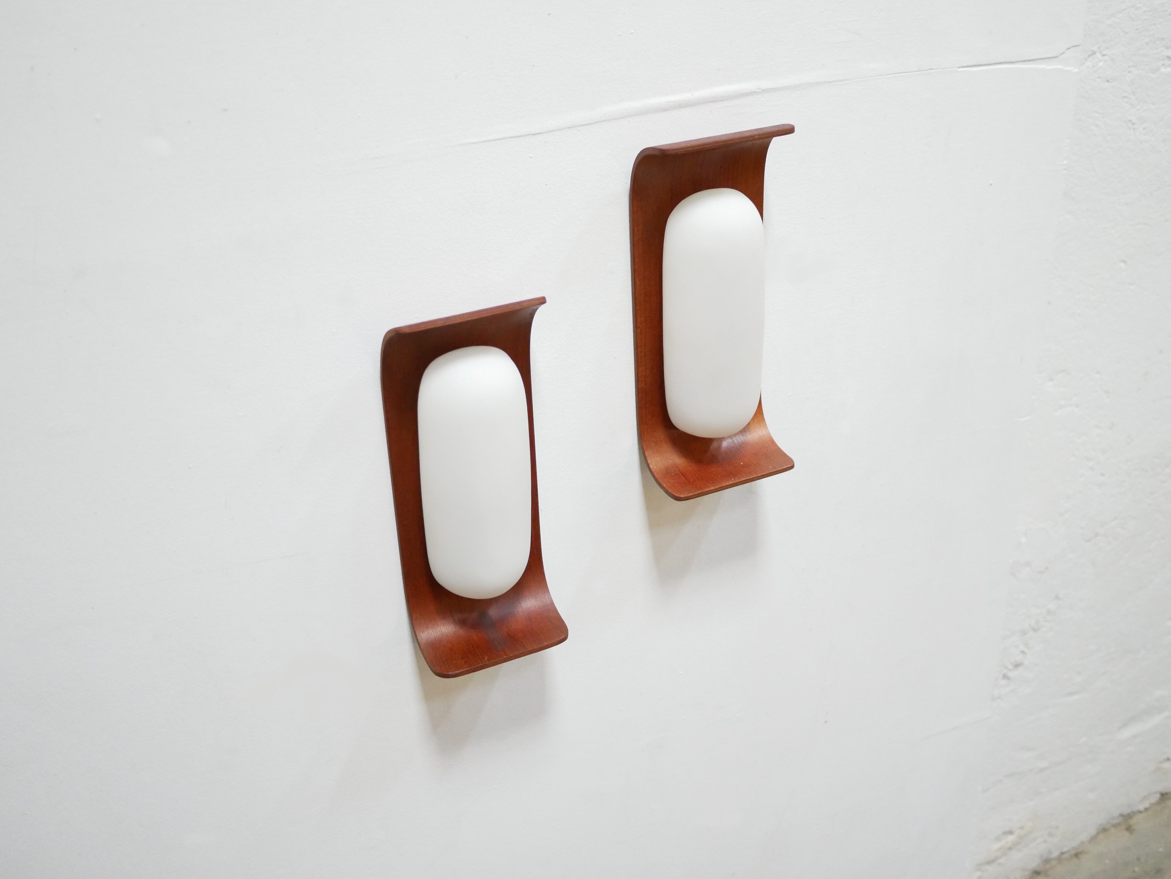 Pair of teak and opaline wall lamps by Goffredo Reggiani