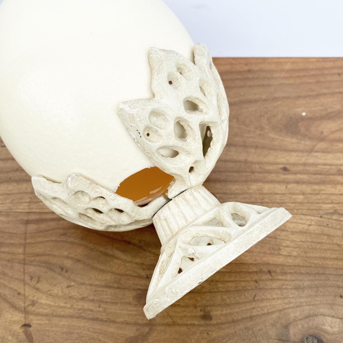 Ostrich egg on pedestal