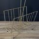 Mid-century magazine rack in golden metal wire