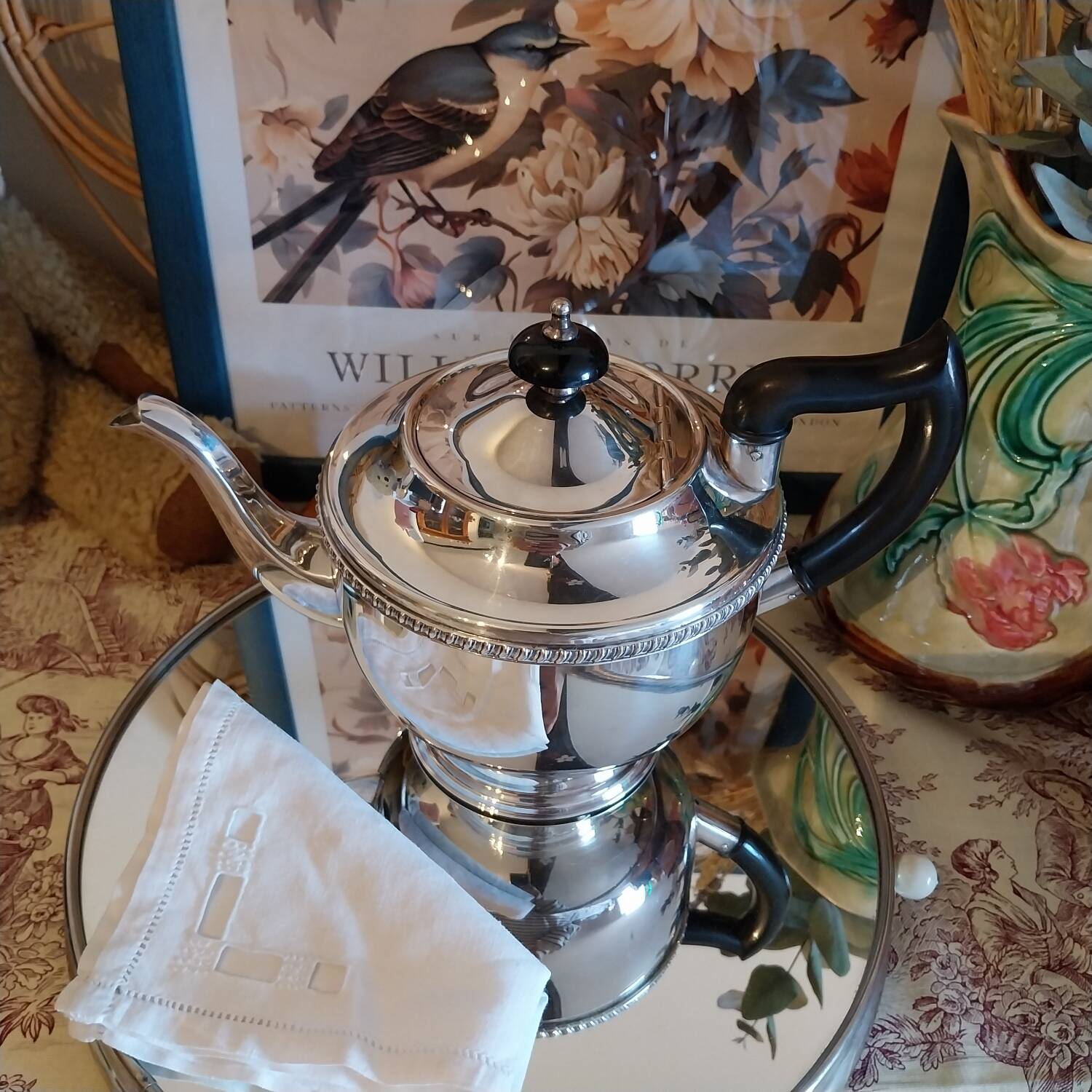 Old English teapot in silver-plated metal and Bakelite.
