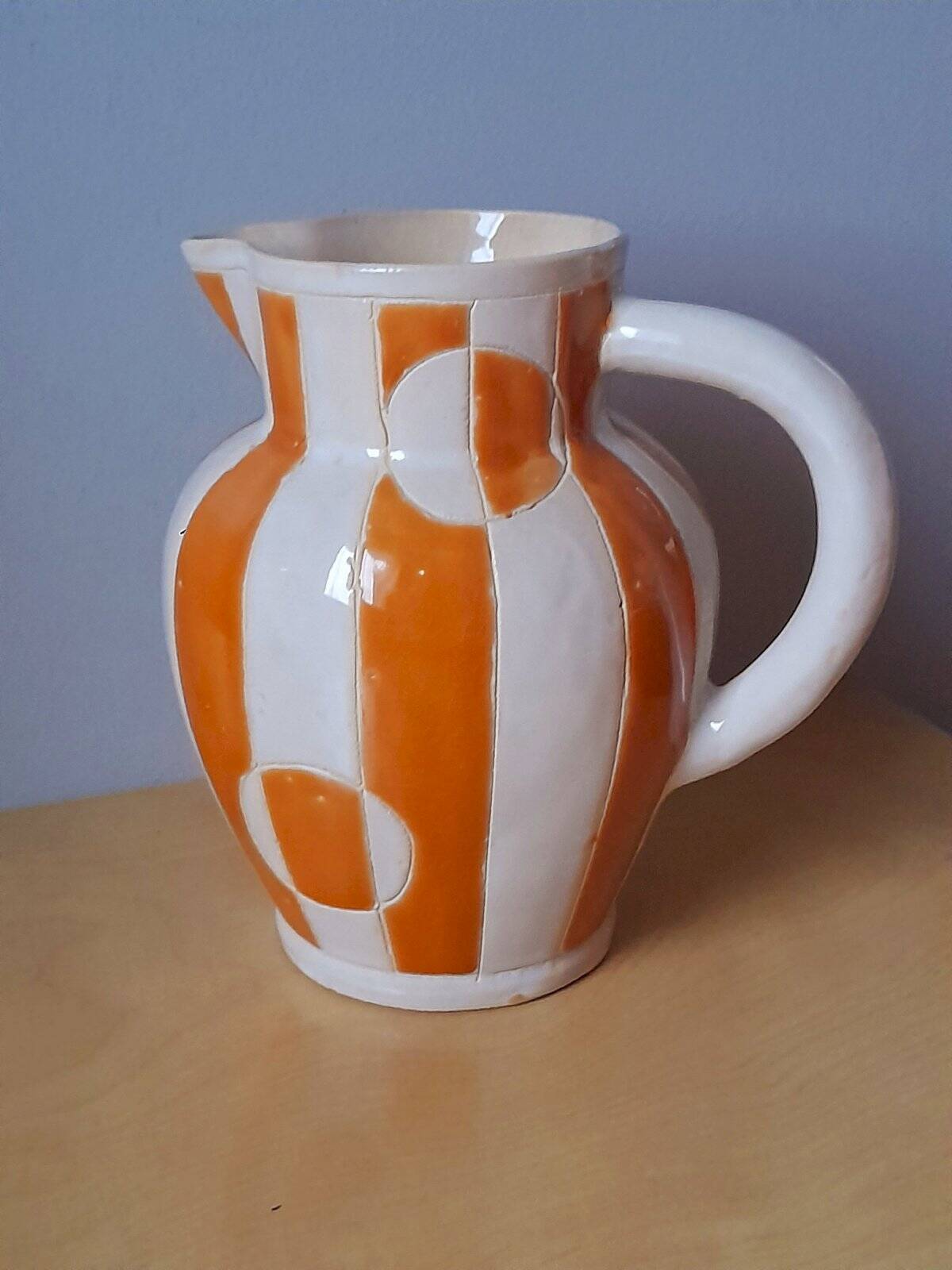 Old enamelled ceramic jug