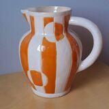 Old enamelled ceramic jug