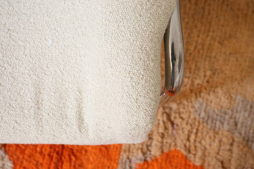 Armchair in ecru wool and stainless steel