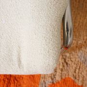 Armchair in ecru wool and stainless steel