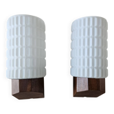 Philips wall sconces in wood and white opal.