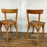 Pair of vintage clear beech baumann chair