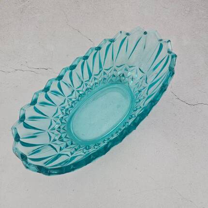 Vintage blue-green turquoise plate in cut and relief glass.