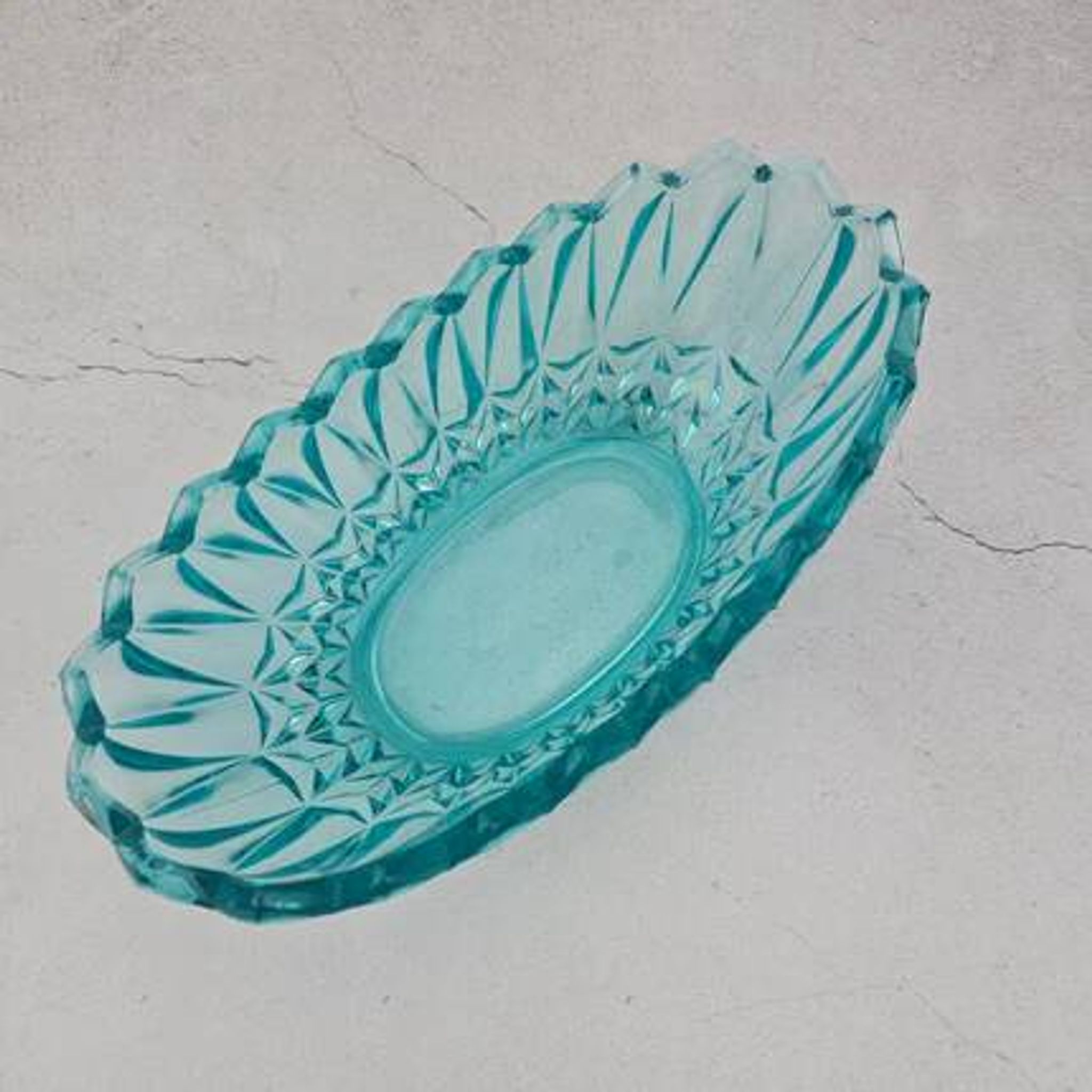 Vintage blue-green turquoise plate in cut and relief glass.