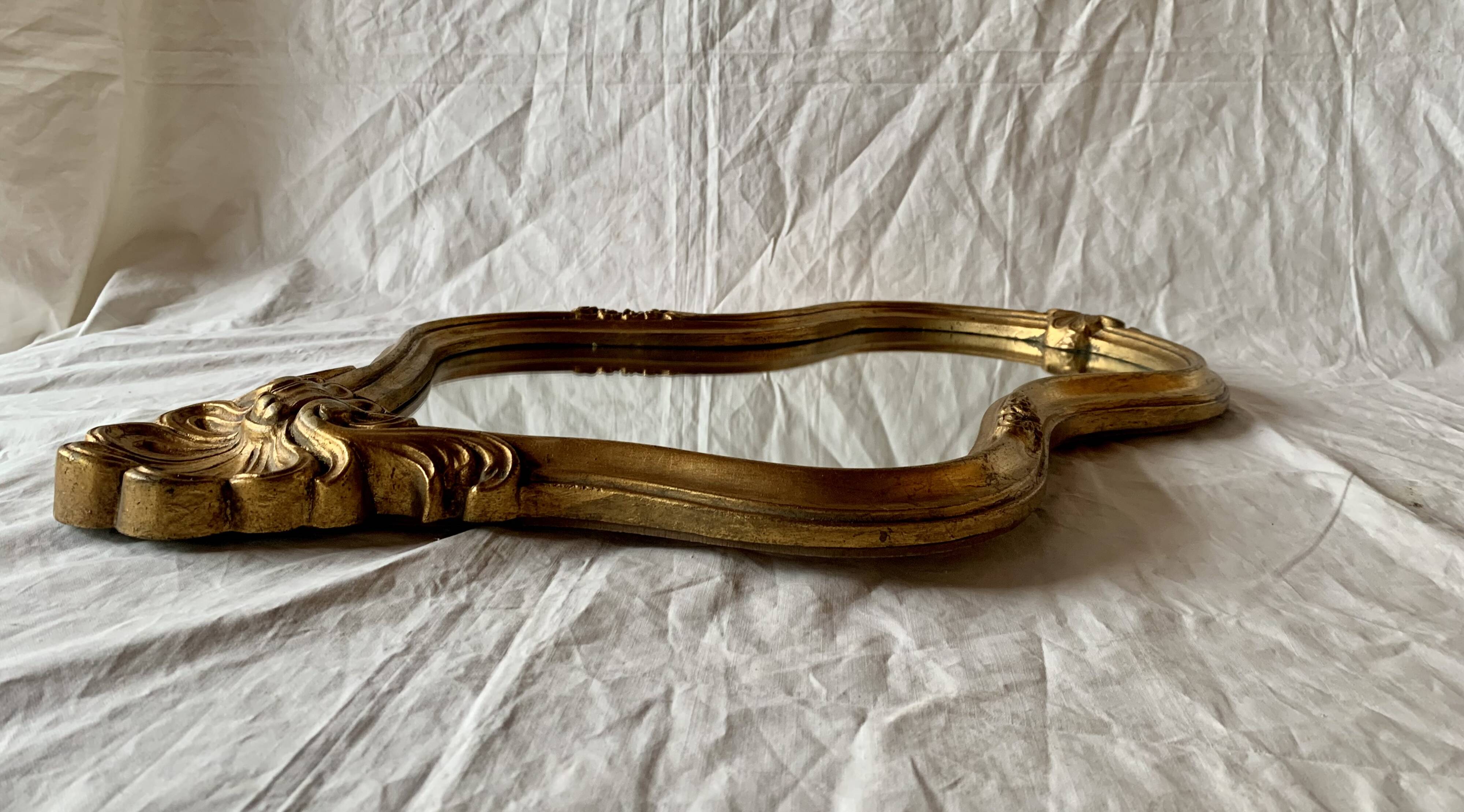 Large rococo mirror in gilded wood