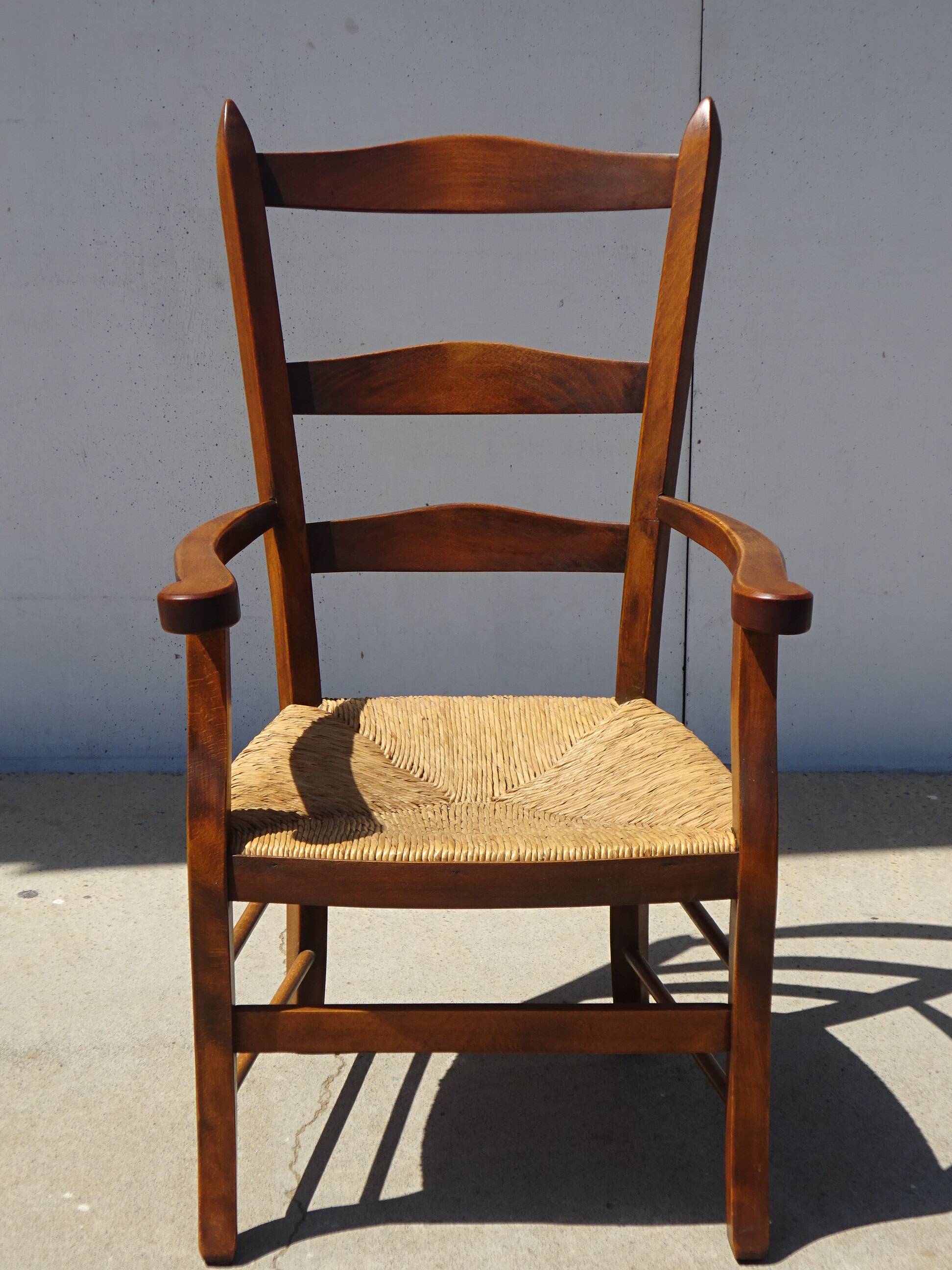 solid wood armchair, straw-covered seat