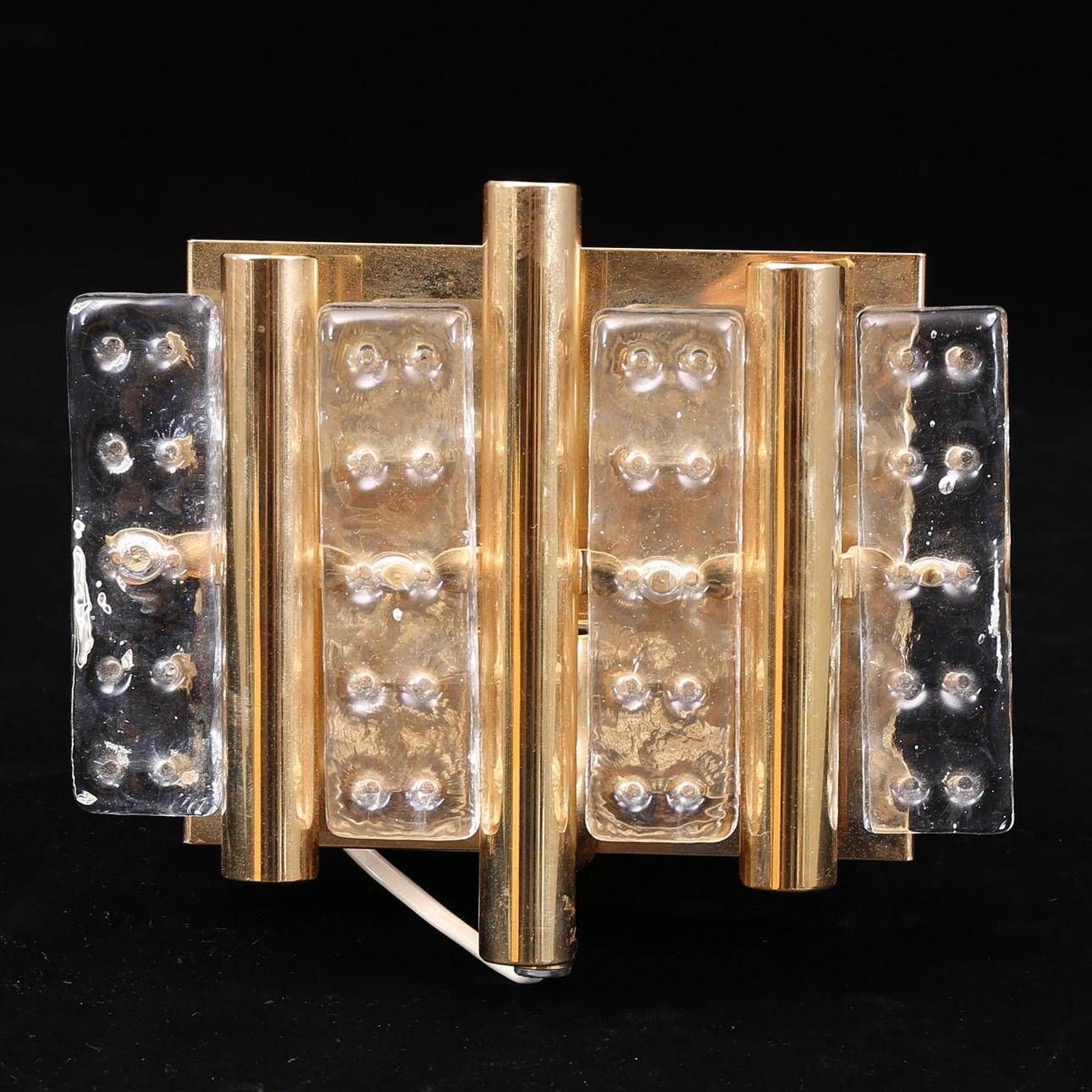 HANS AGNE JAKOBSSON. A pair of glass and brass wall lights