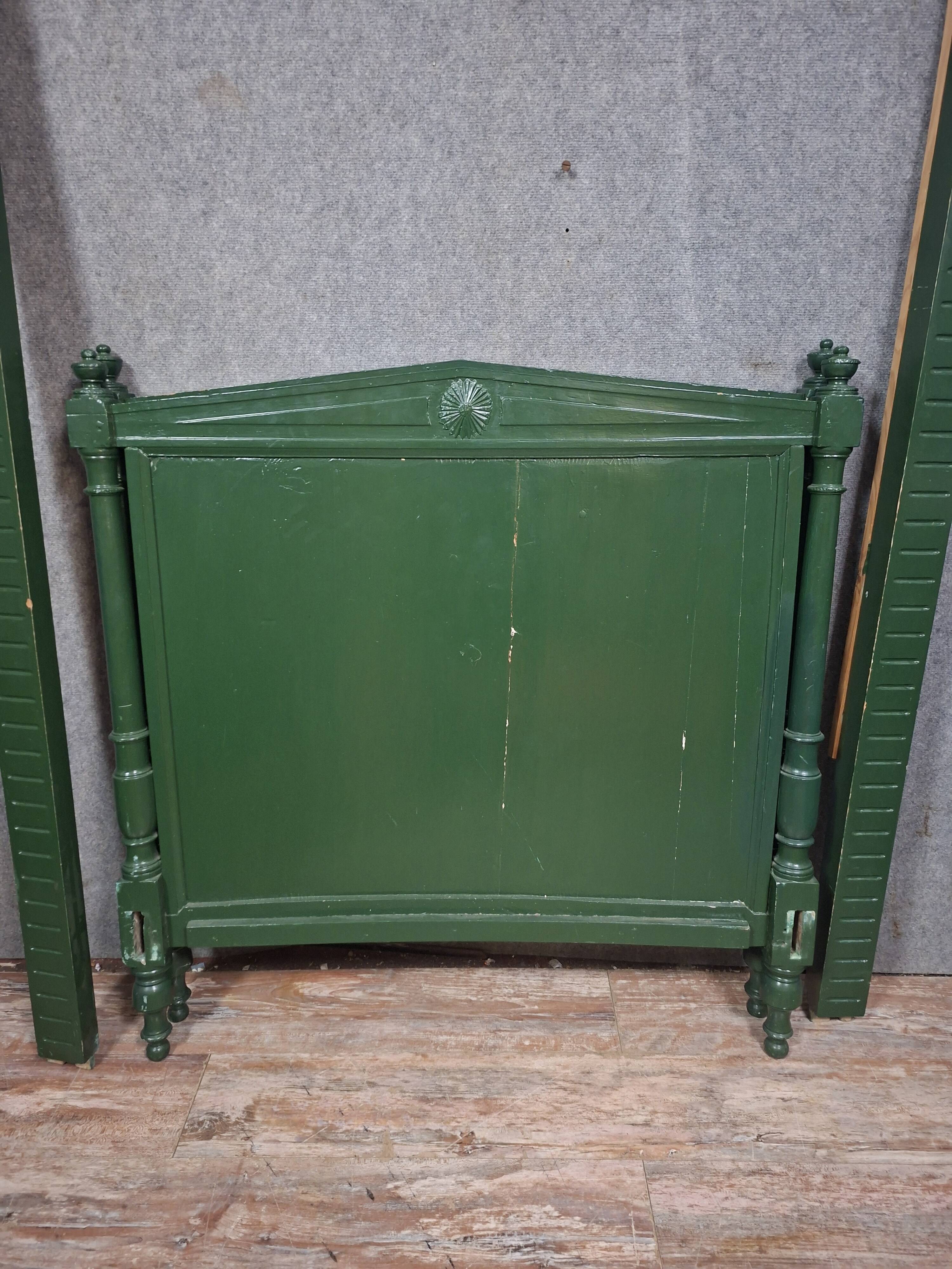 Directoire style bed in painted green wood.