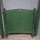 Directoire style bed in painted green wood.