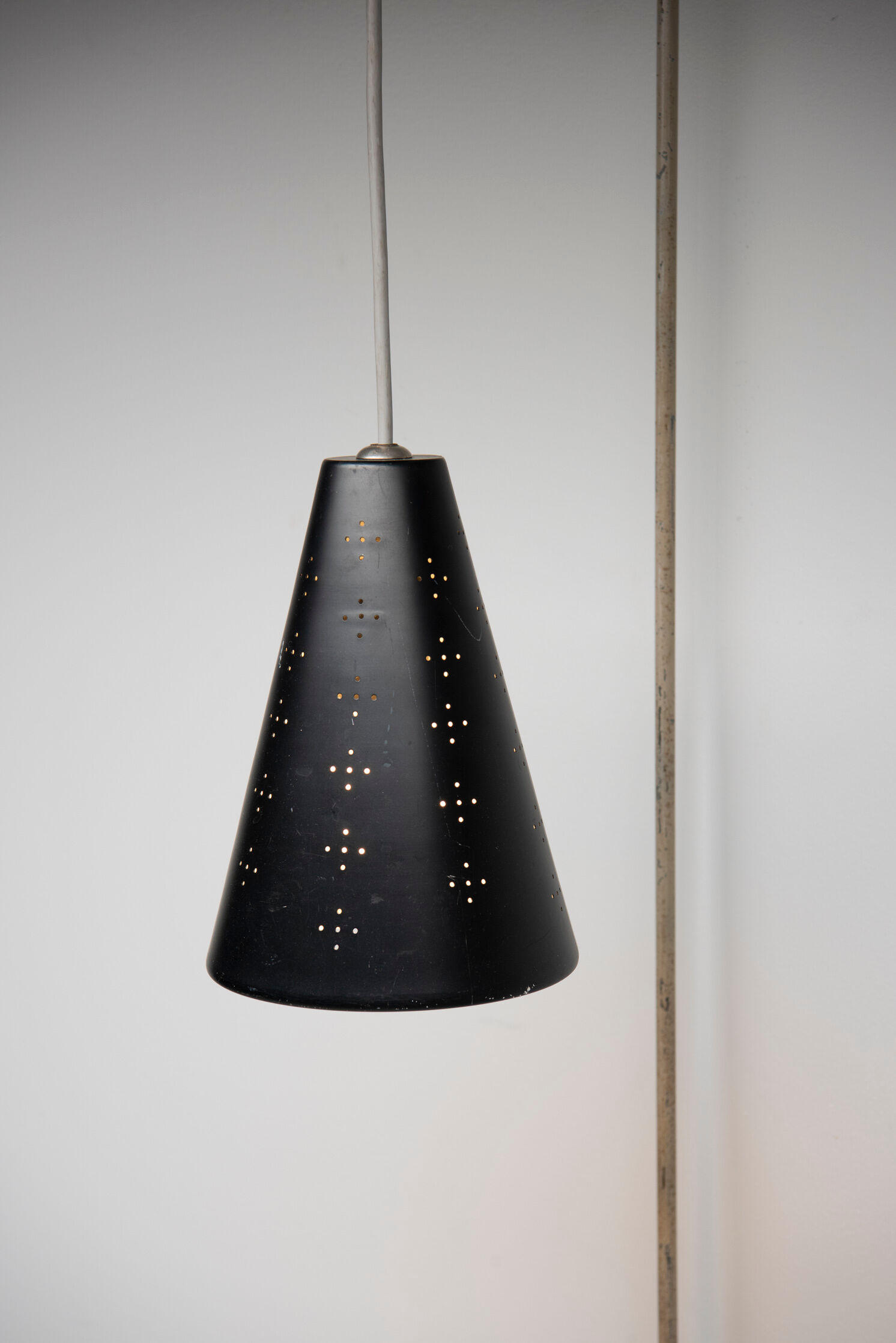 Hanging wall lamp with black perforated cap, 1960's